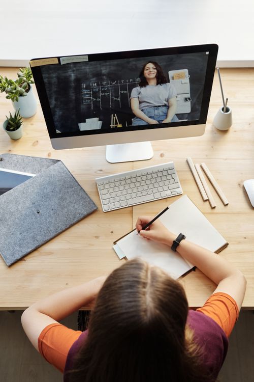 Student watching free online course video on computer