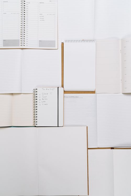Notebooks representing simple brand kit template for creators