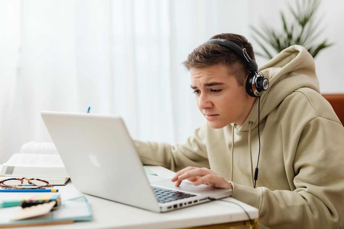 Person using laptop to study free online course