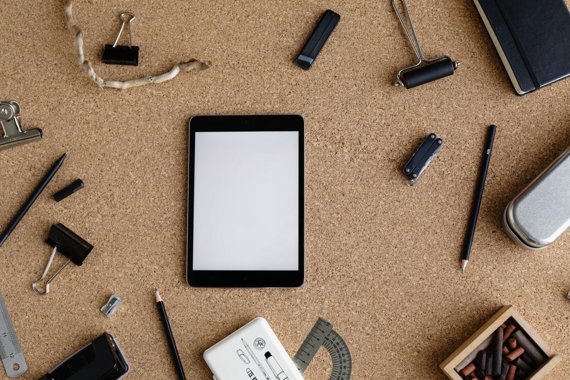 Organized flat lay of digital toolkit resources and stationery