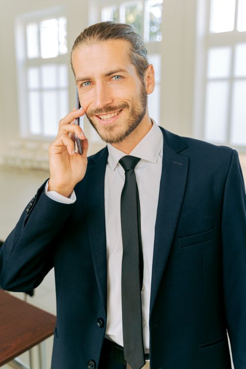 Business owner using AI writing tools on phone for professional communication