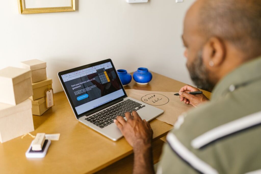 How small businesses use AI to save time - owner reviewing website on laptop