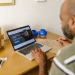 How small businesses use AI to save time - owner reviewing website on laptop