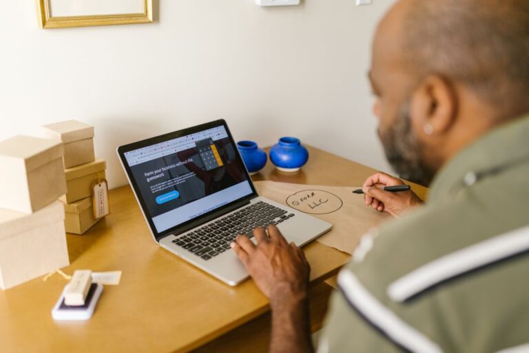 How small businesses use AI to save time - owner reviewing website on laptop