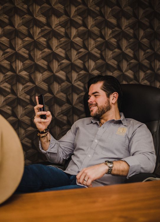 Smiling business owner using AI automation simple tool to save time